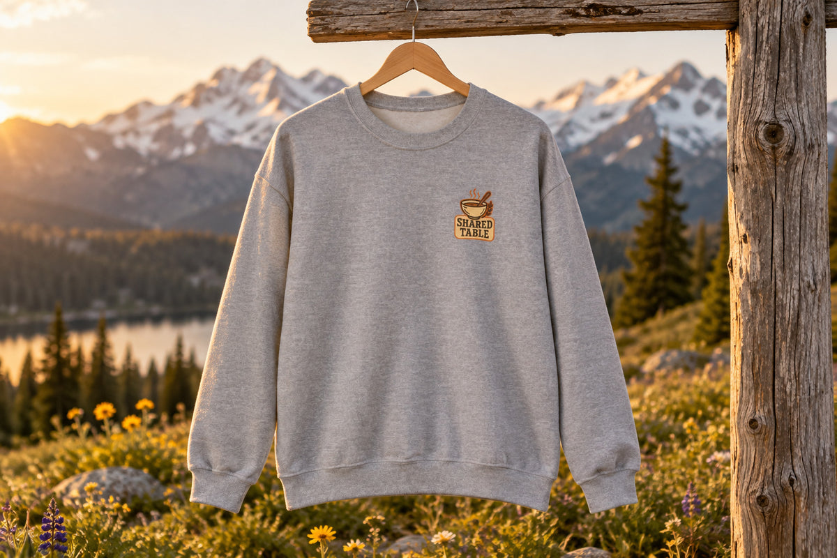 Friendsgiving Sweatshirt - Sport Grey on a wooden hanger outdoors | MR7ART