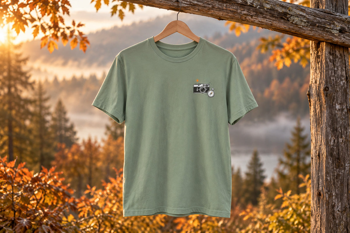 Retro Camera Tee - Sage on a wooden hanger outdoors | MR7ART