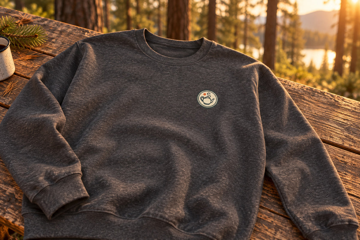 Vintage Teapot Sweatshirt - Dark Heather on a rustic wooden table | MR7ART