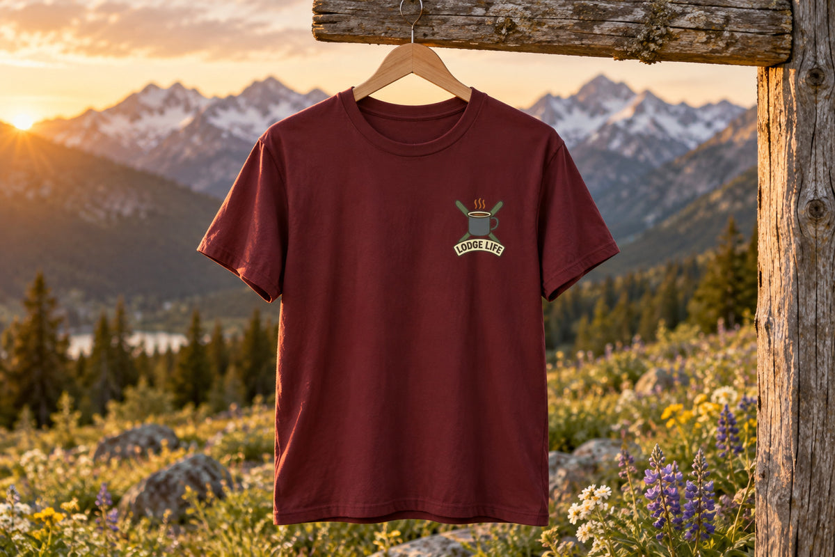 Ski Lodge Tee - Maroon on a wooden hanger outdoors | MR7ART