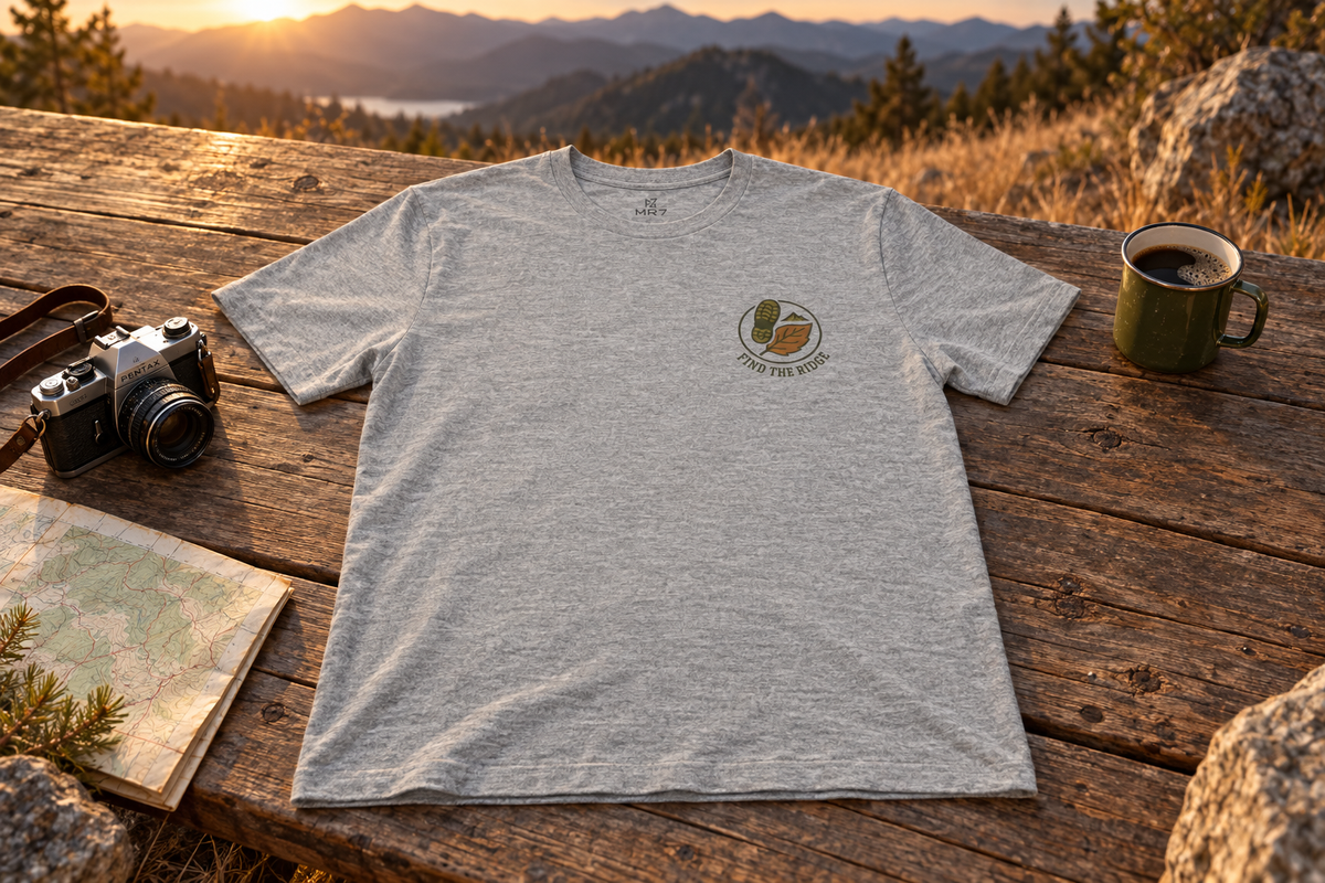 Hiking Tee t-shirt on a rustic wooden table outdoors