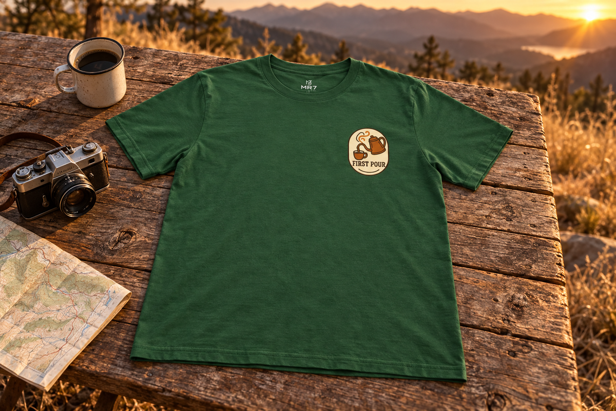 Pour Over Coffee Tee t-shirt on a rustic wooden table outdoors