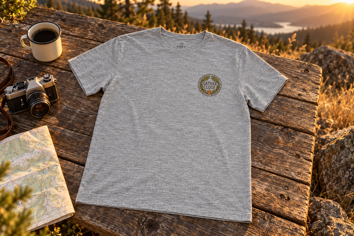 Thanksgiving Wreath Tee t-shirt on a rustic wooden table outdoors