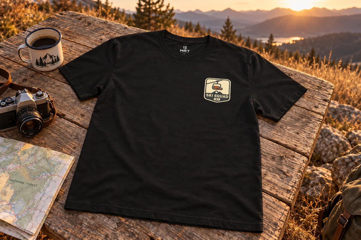 Ski Trip Tee t-shirt on a rustic wooden table outdoors