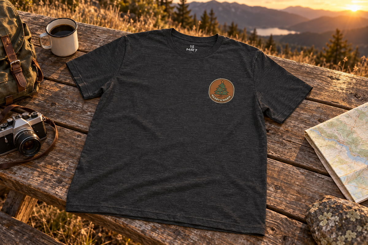 Christmas Tree Tee t-shirt on a rustic wooden table outdoors