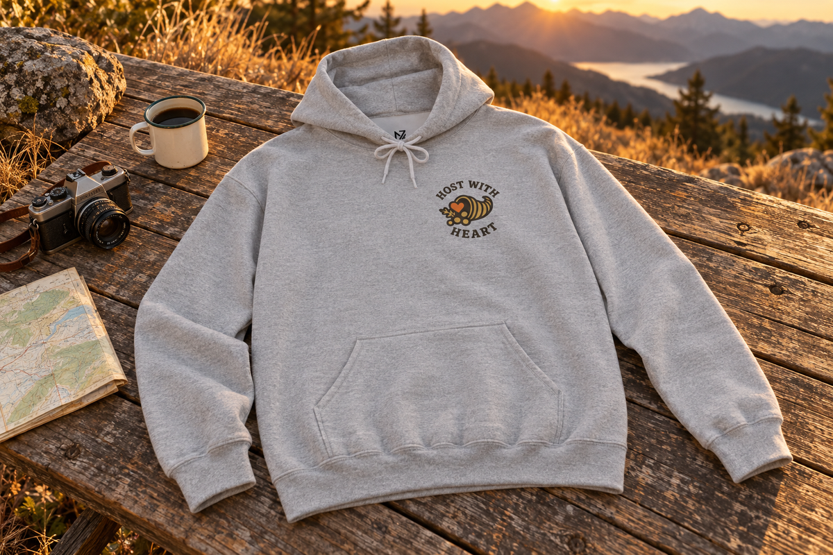 Thanksgiving Host Gift Hoodie hooded sweatshirt on a rustic wooden table outdoors
